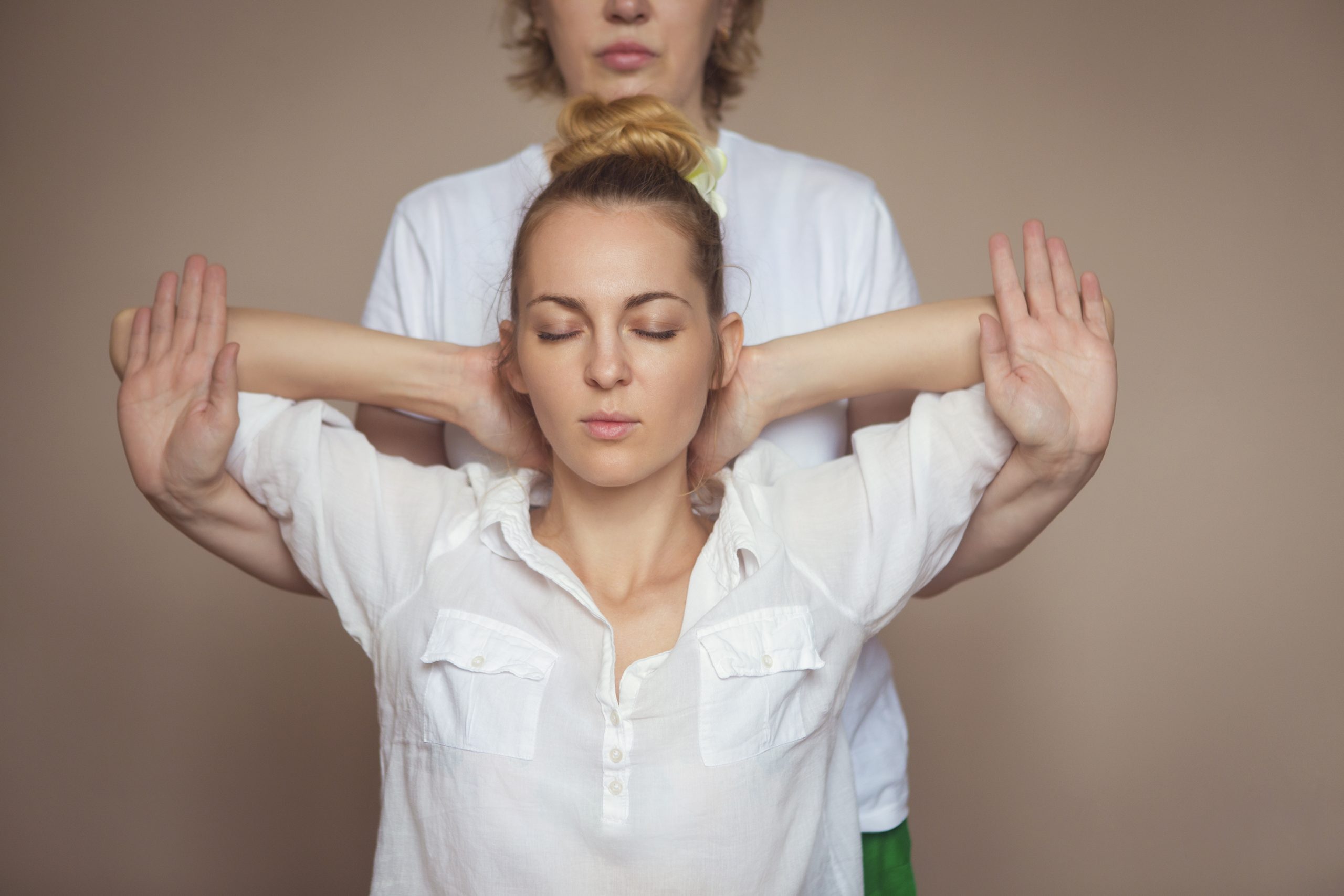 Young woman having massage treatment in health centre.